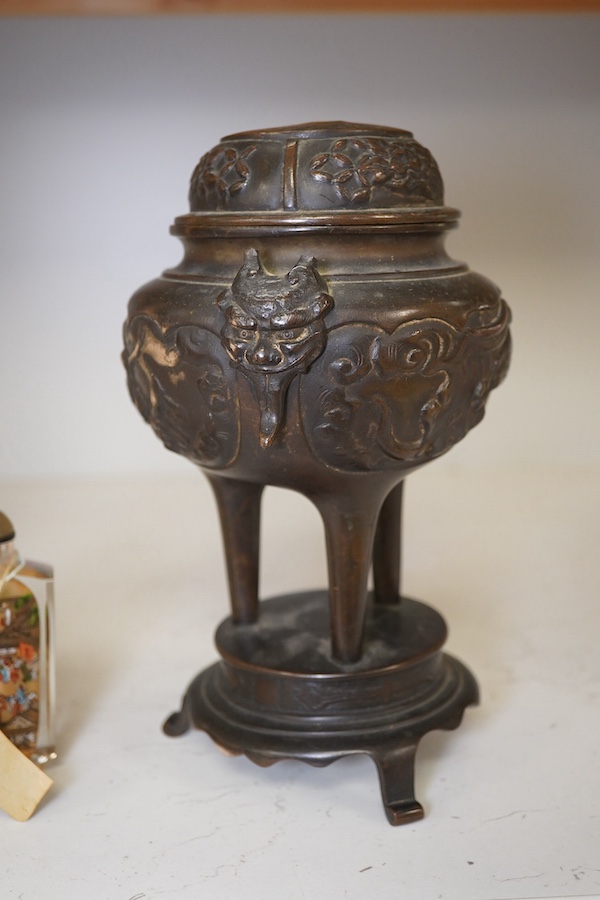 A Japanese bronze koro and cover, 23.5cm high, together with a inside painted glass snuff bottle, 8.5cm high. Condition - fair, dog detached from cover of koro, etc.